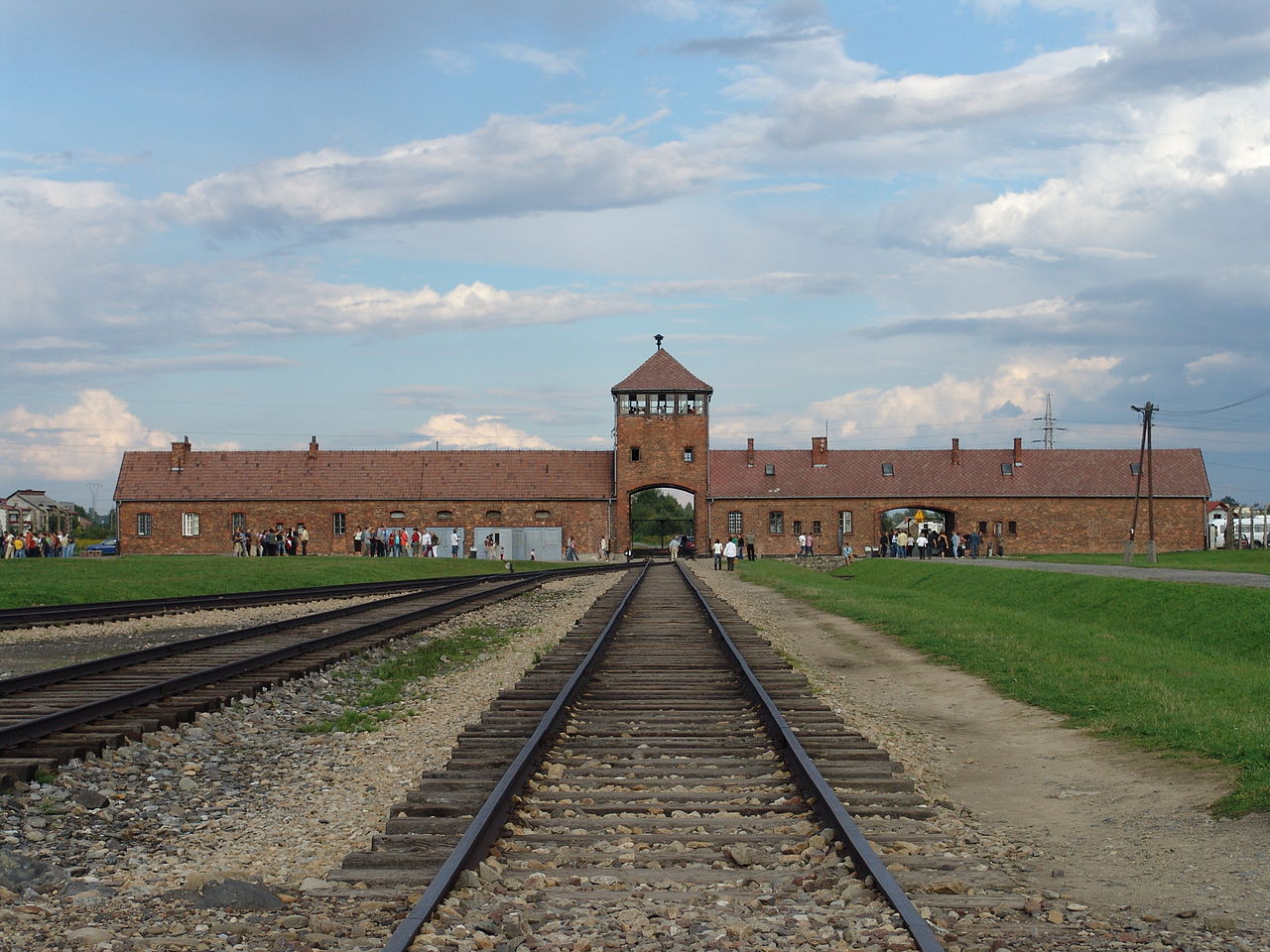 The main guard tower and entrance gate at Auschwitz II-Birkenau, through which deportation trains passed